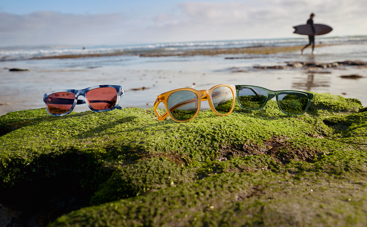 Costa del Mar® Eyewear Featuring Barberini® Sunglass Lenses Costa Del Mar® sunglasses with Barberini® sunglass lenses displayed on a coastal rock, highlighting premium optics, durability, and performance-inspired eyewear.